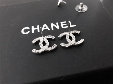 authentic Chanel logo stud earrings